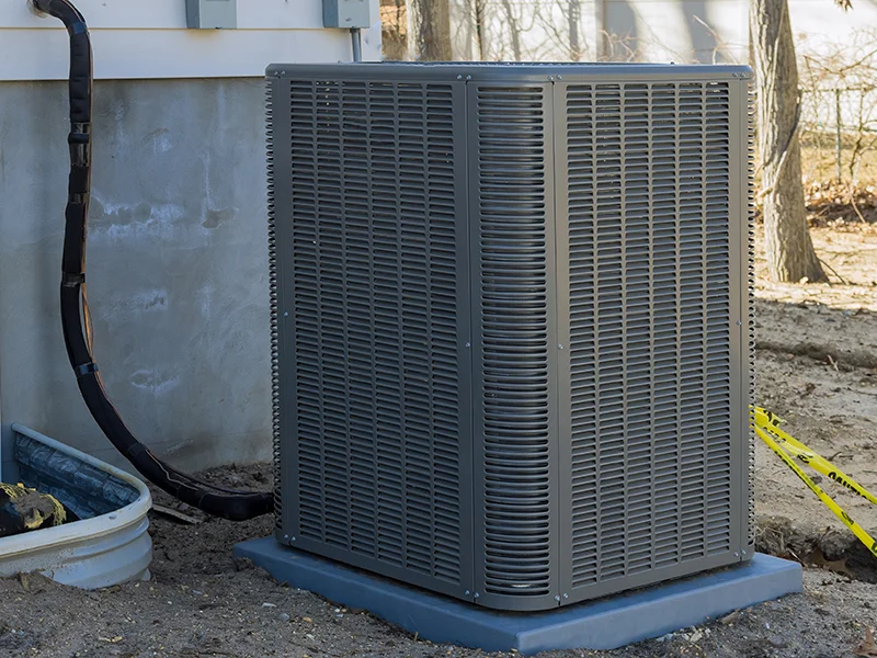 Air conditioning unit outside a home, emphasizing HVAC maintenance and efficiency for furnace repair services in Galt, CA.