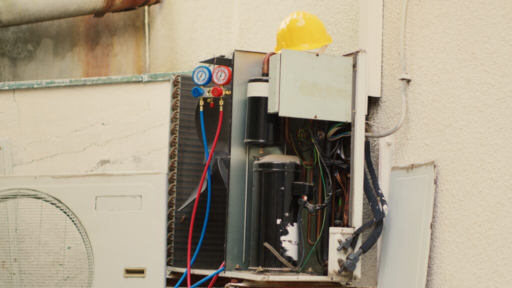Furnace installation unit with pressure gauges and safety helmet, emphasizing HVAC service and proper setup for efficiency and safety.